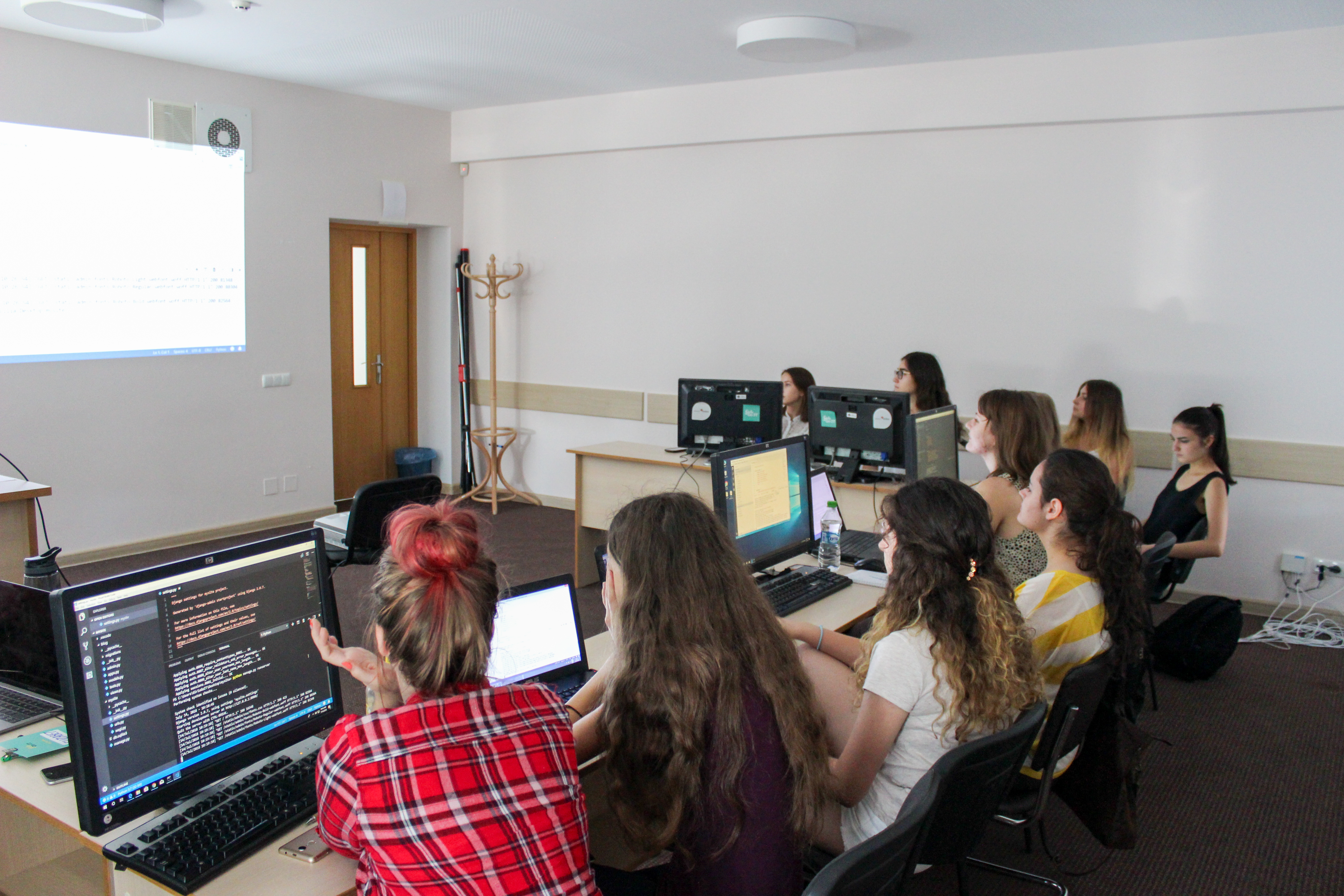 Girl coding on a laptop